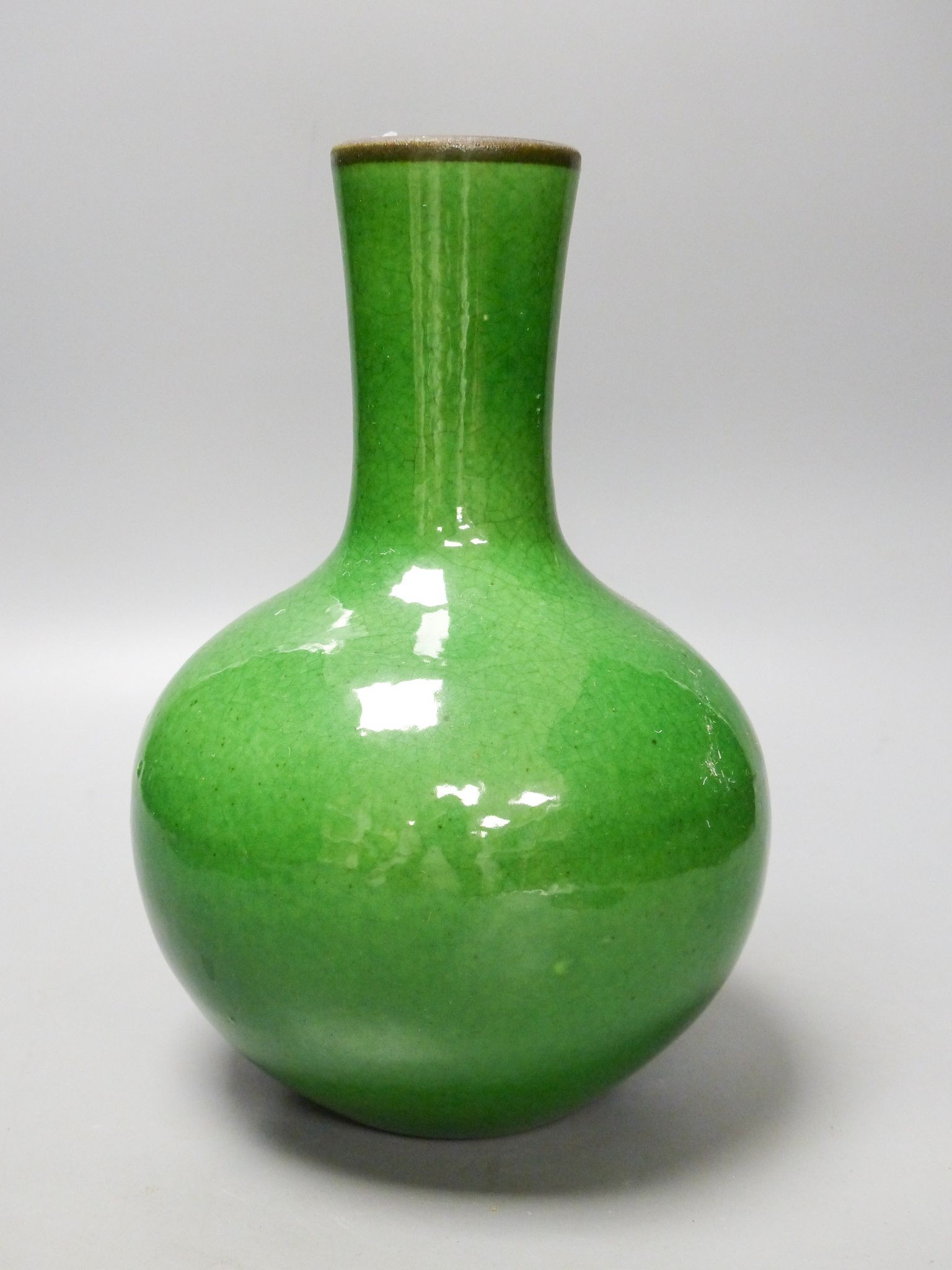 A Chinese green crackle glaze monochrome bottle vase, 24 cm high